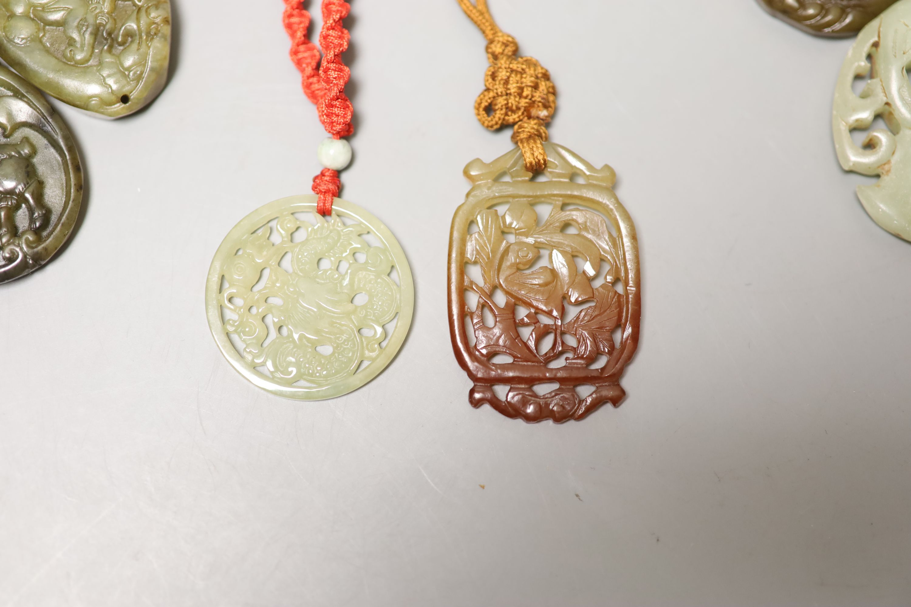 Eight Chinese hardstone pendants